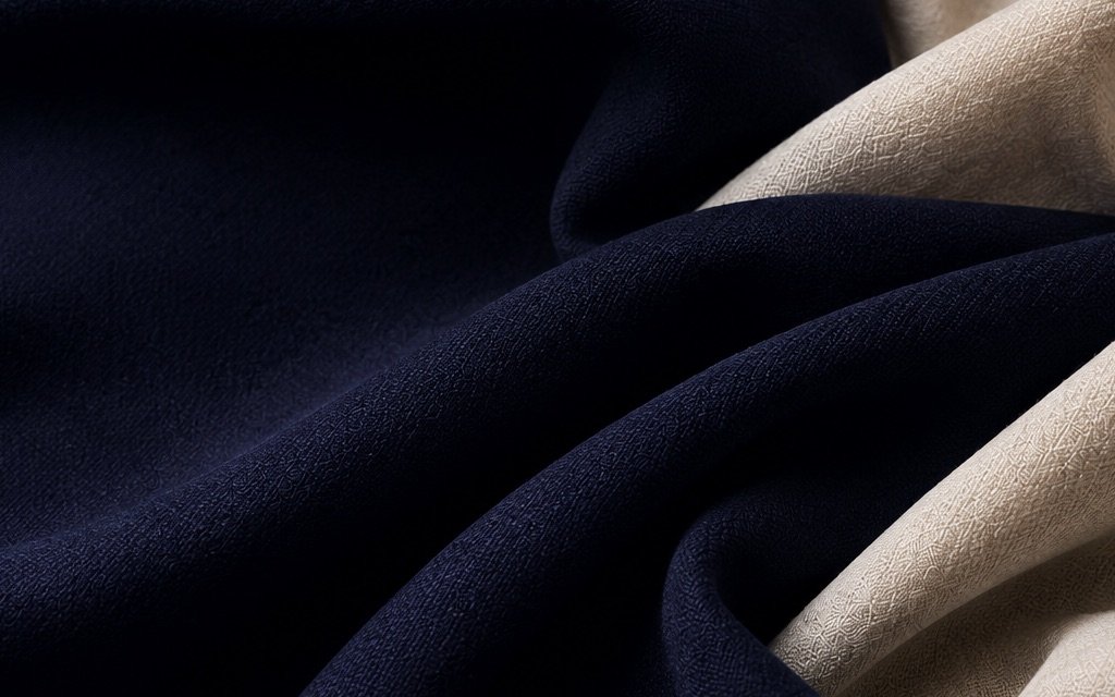 Folded fabric swatches in navy and ivory